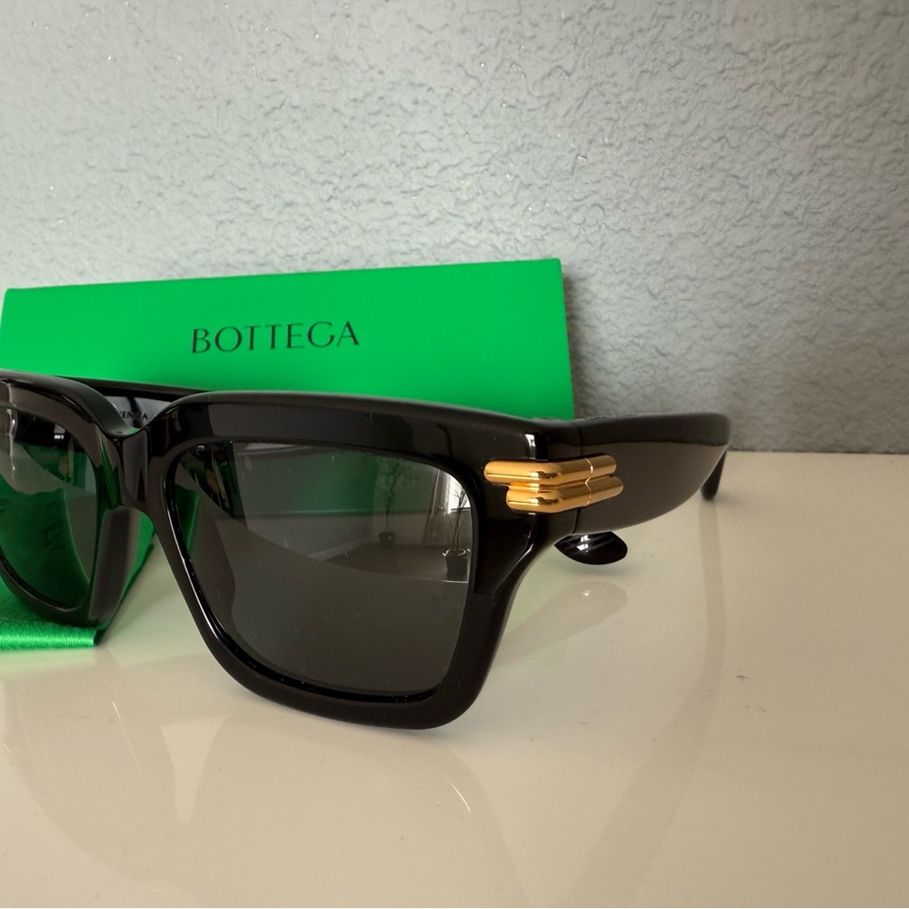Bottega Veneta Black and Gold Sunglasses with Contemporary Design